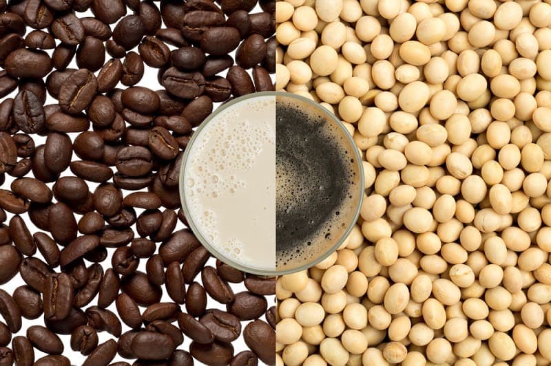 haft cup of coffee and soy milk on coffee beans and soy bean