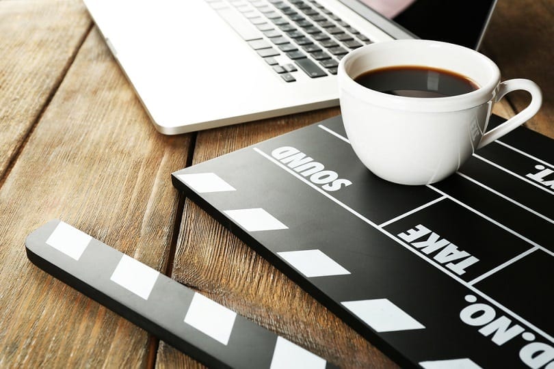 Movie clapper with cup of coffee_Africa Studio_shutterstock