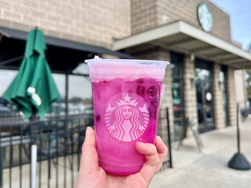 starbucks dragon drink bright pink with dragonfruit outside cafe_kate