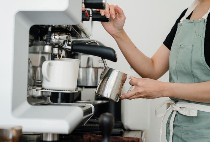 Barista whipping milk