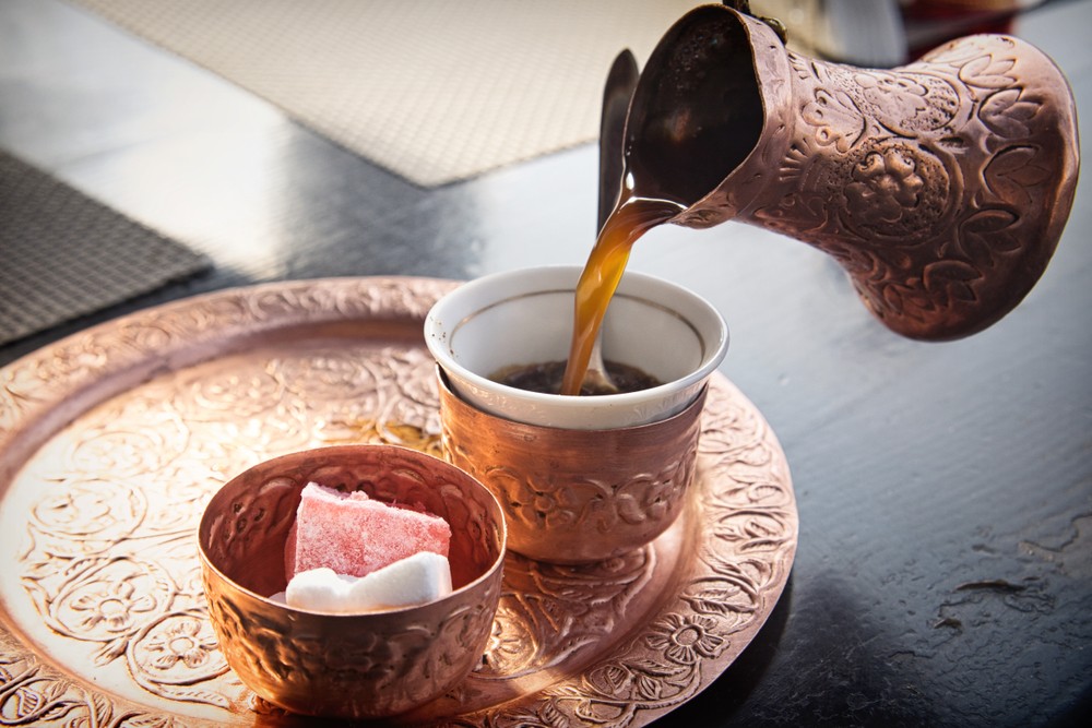 Bosnian coffee pouring copper pot