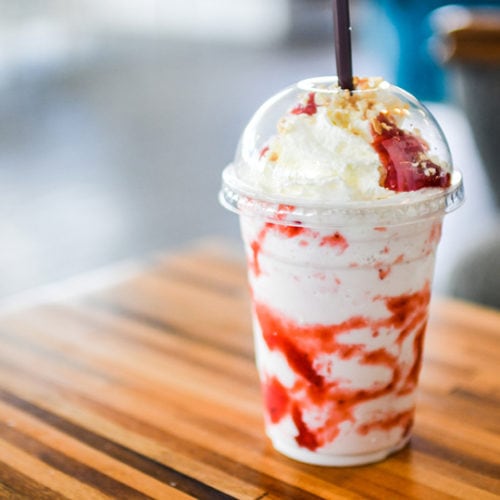 Strawberry Cheesecake Frappuccino on wooden table