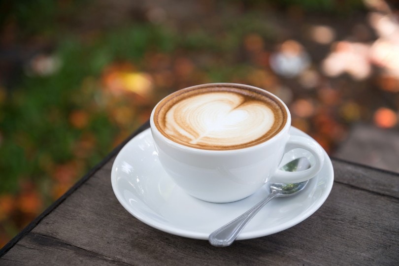 a cup of coffee on a table outdoor