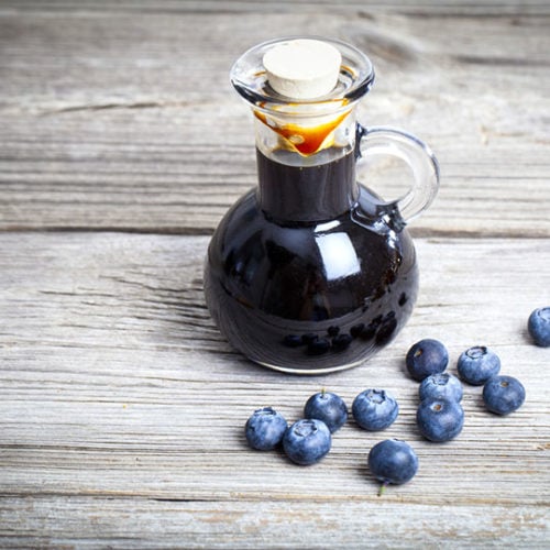 blueberry syrup in glass bottle