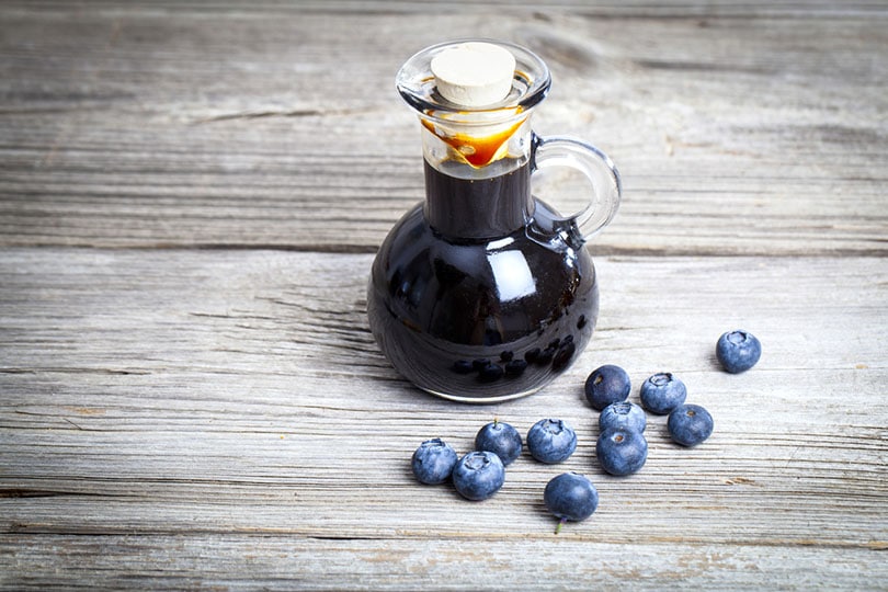 blueberry syrup in glass bottle