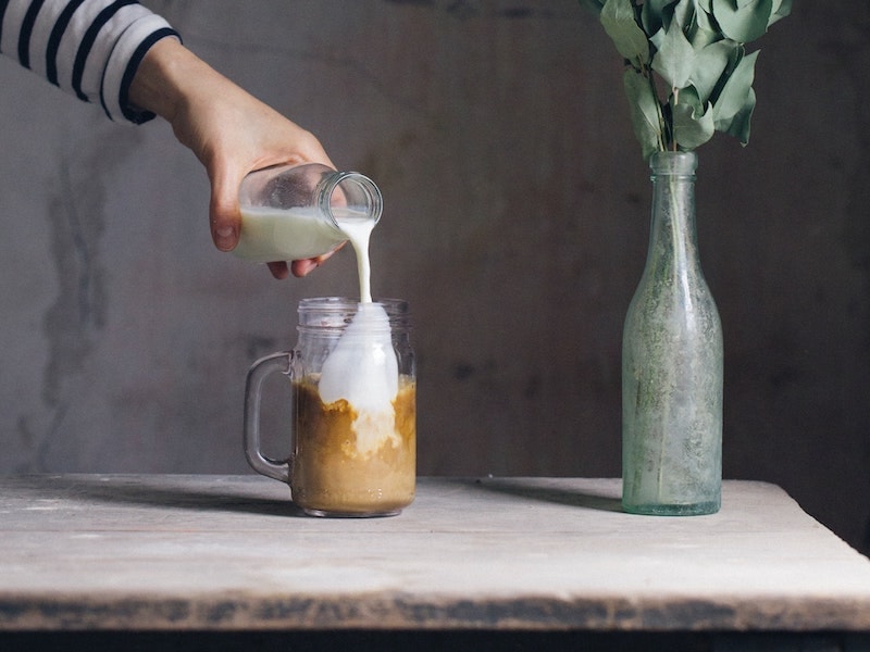 deconstructed coffee pouring milk into espresso