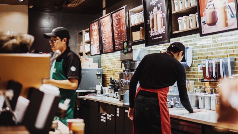 starbucks baristas behind the counter