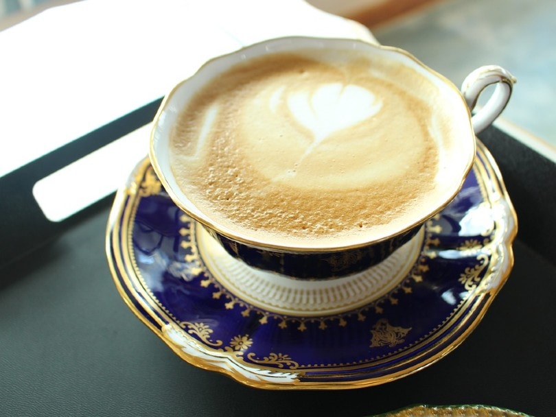 tea latte in an elegant cup with saucer