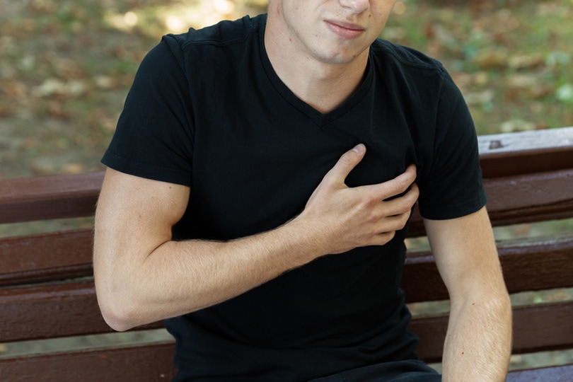 outdoor portrait of a man with heart attack in the park