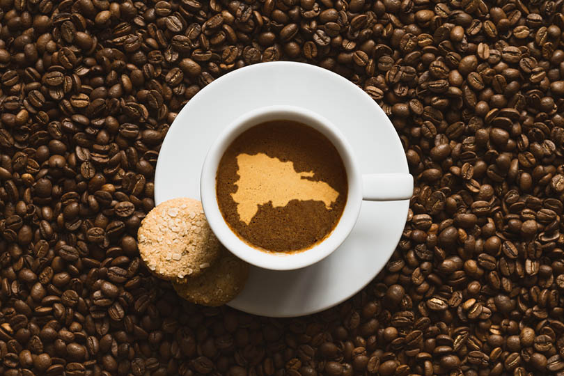hot coffee beverage with map of Dominican Republic