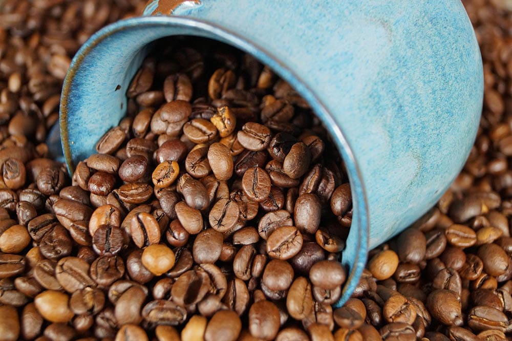 ceramic mug and coffee beans