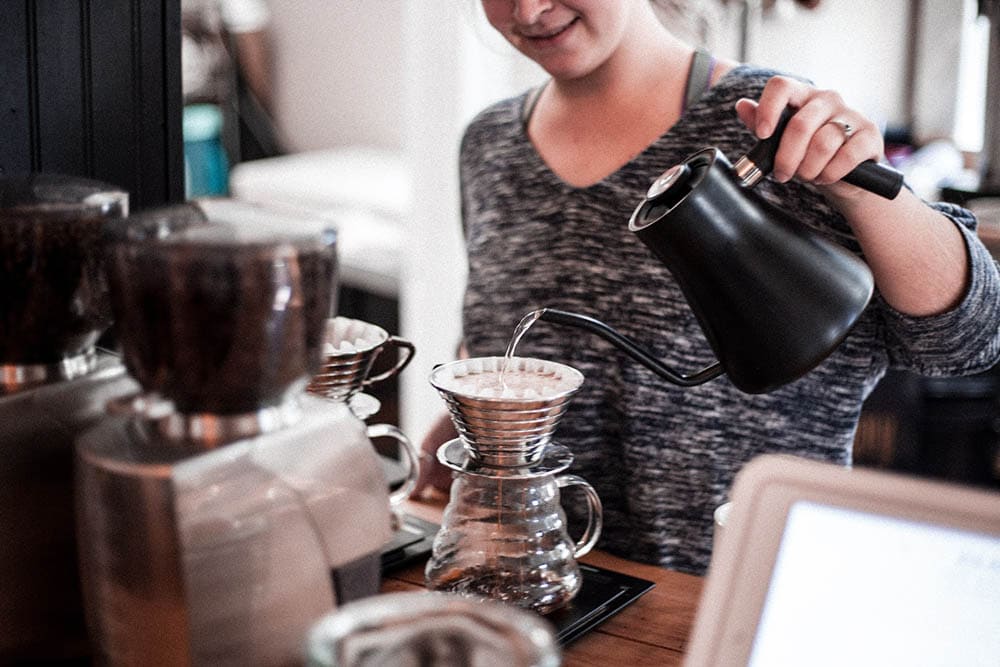 woman making a pour-over coffee