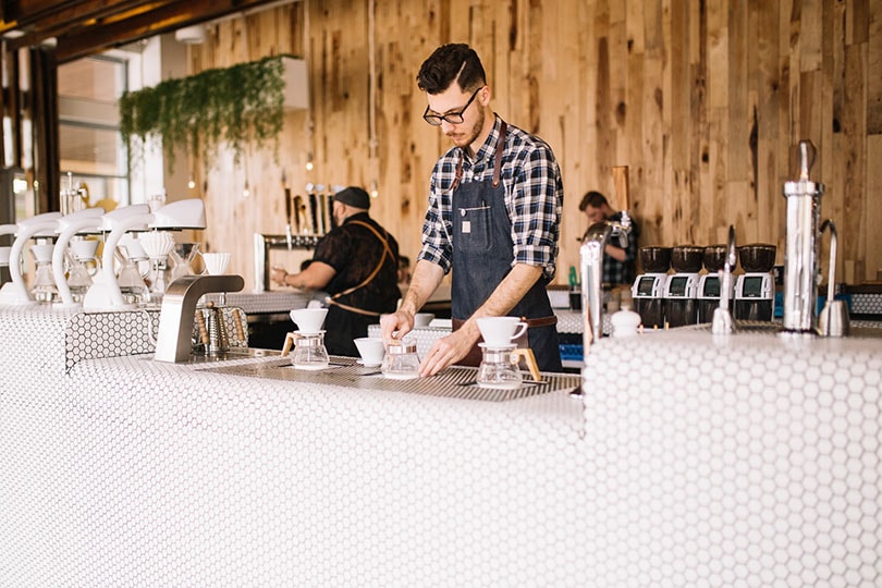 barista preparing coffee at the counter