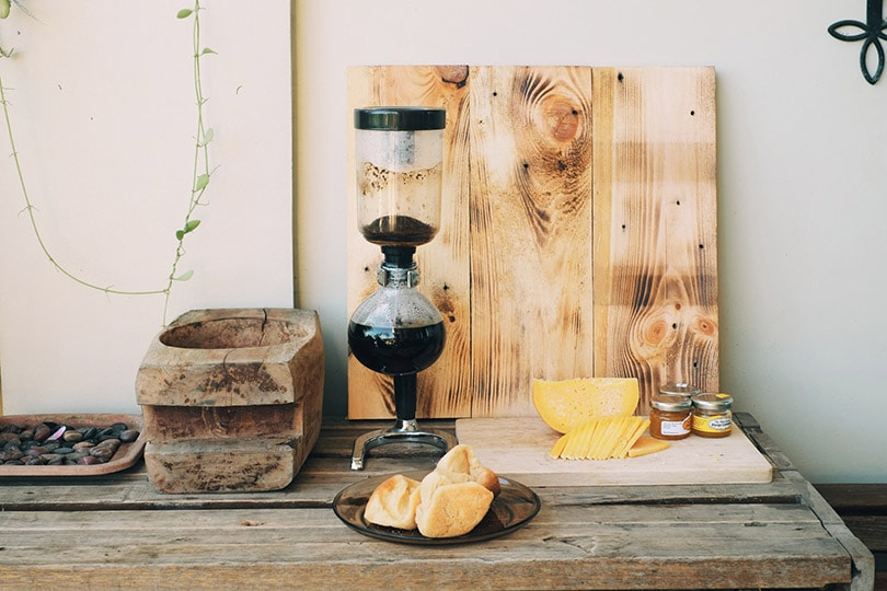 siphon coffee maker on a wooden table