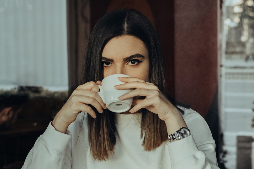 a woman drinking coffee