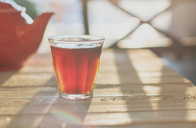 a glass of sweet tea on wooden table