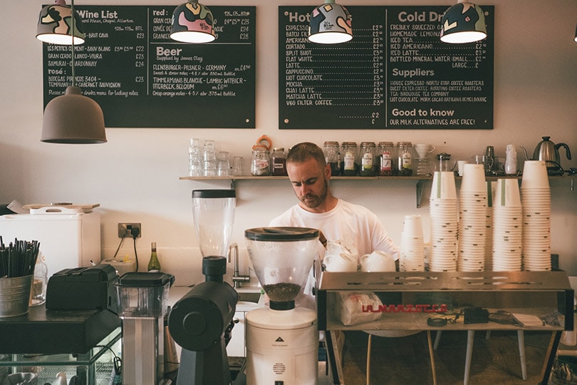 barista at a coffee shop counter