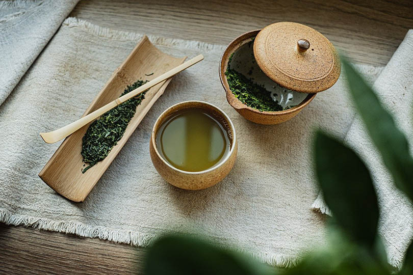 green tea in a wooden cup