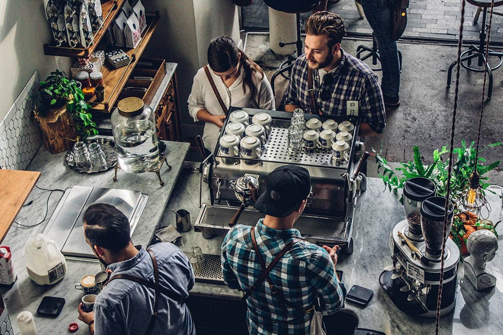 male and female ordering at the cafe counter