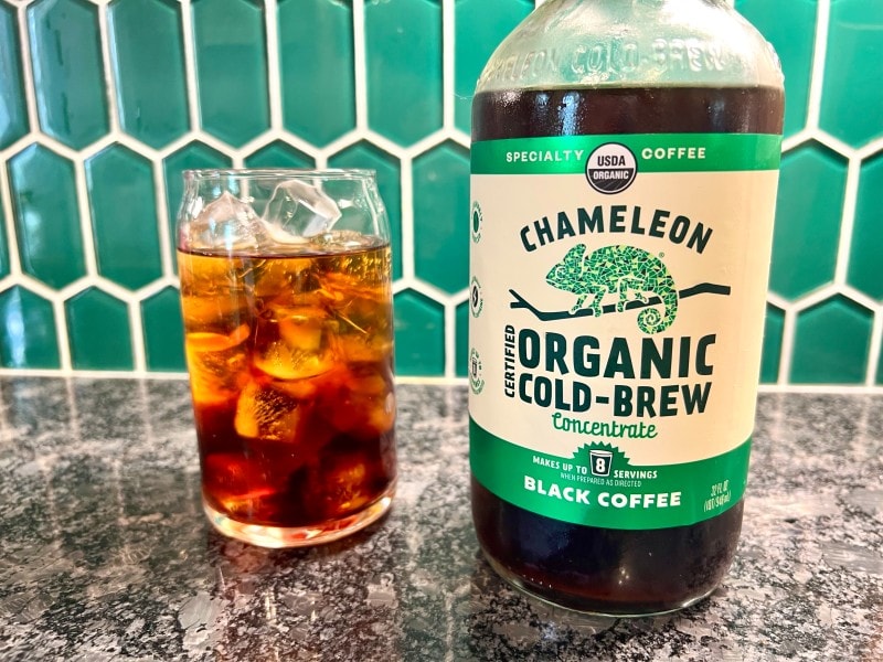 Chameleon organic cold brew concentrate next to glass