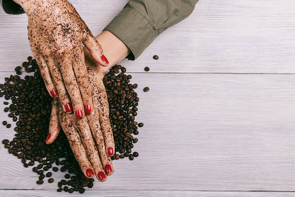 coffe scrub on woman's hands