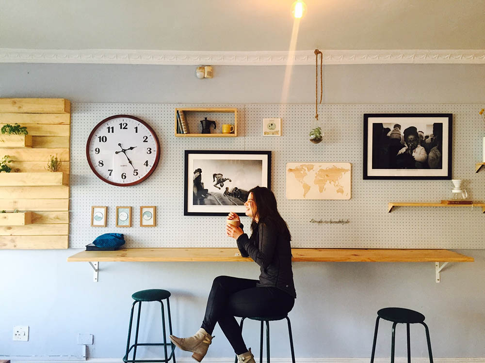 happy woman having coffee in a cafe