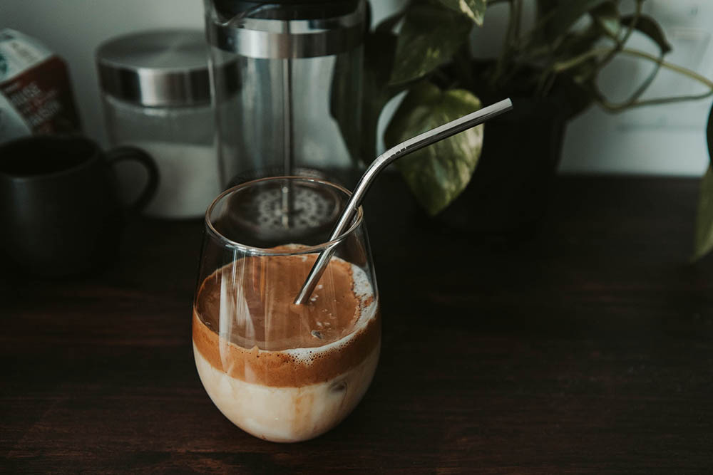 homemade coffee with reusable metal straw
