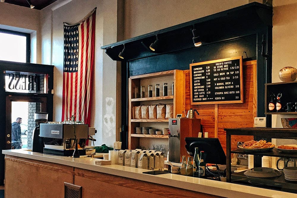 interior of a coffee shop with american flag