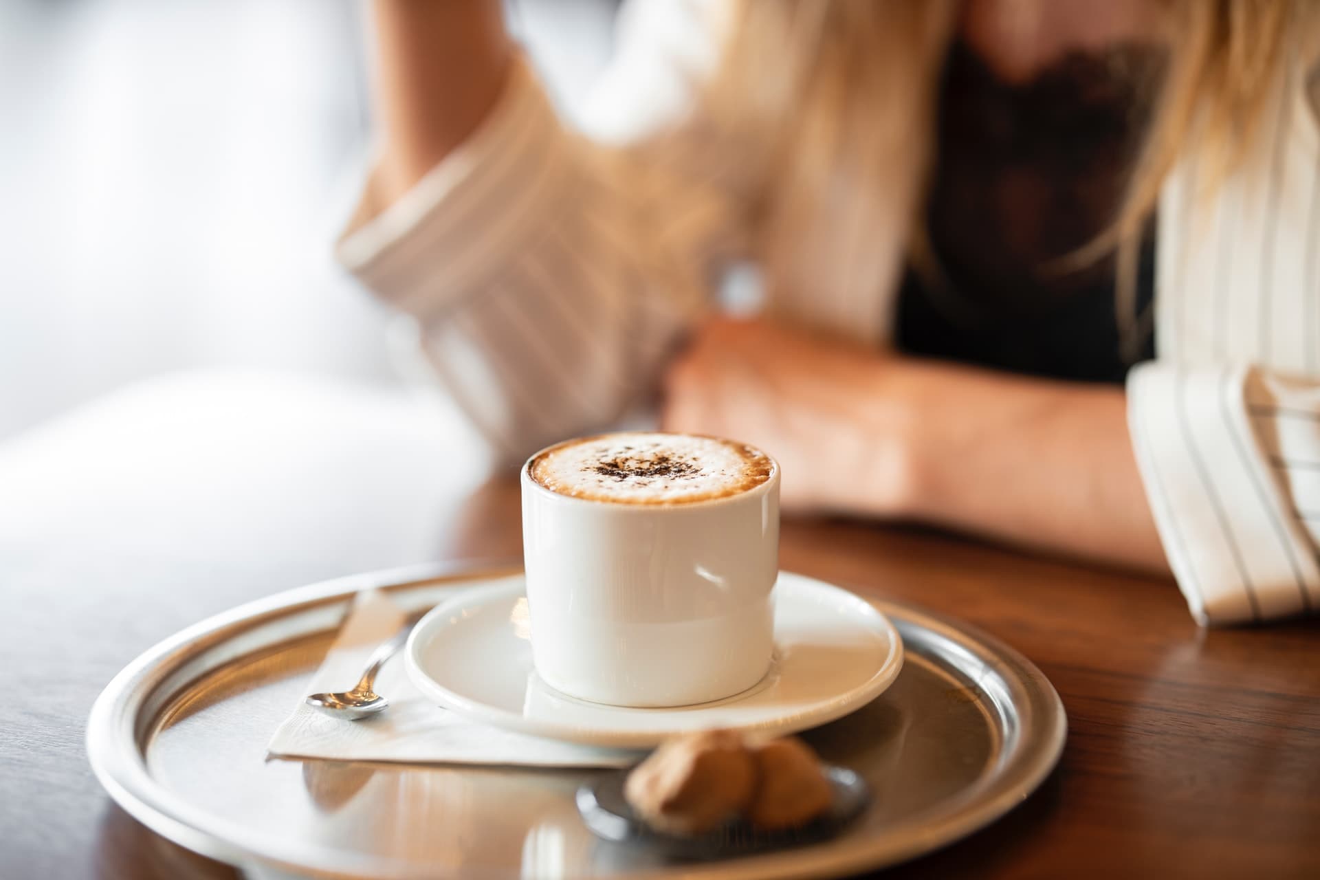 woman with a cup of coffee in the table