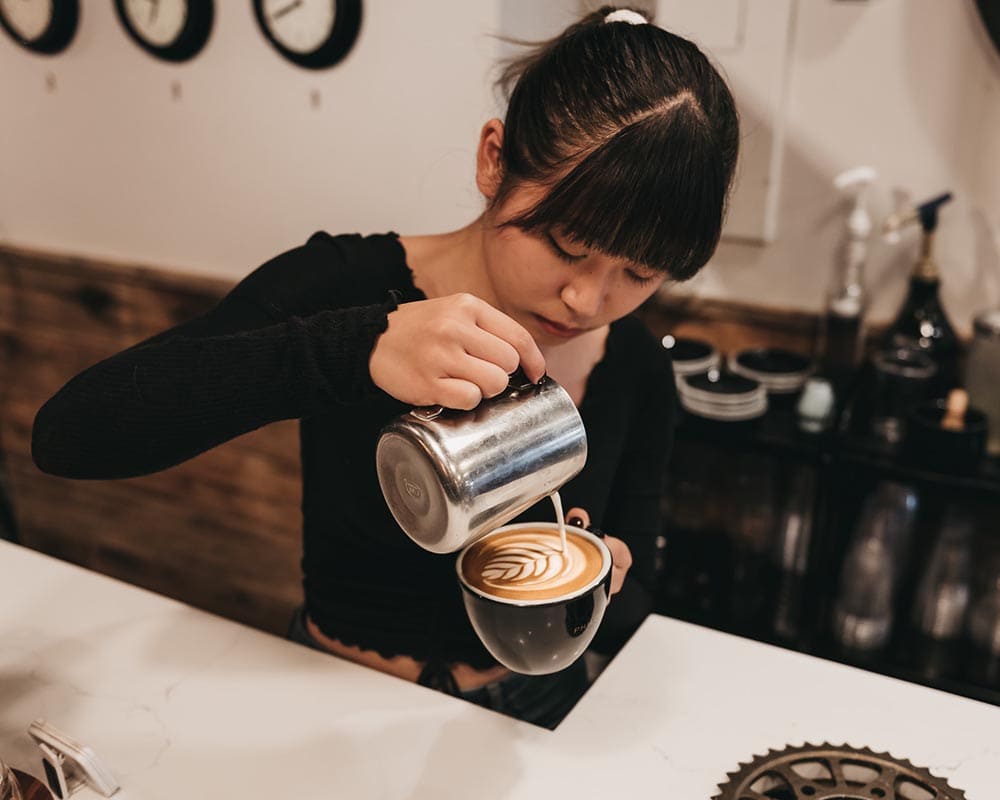 barista preparing a cup of coffee