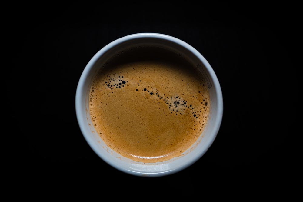 cup of coffee on black background