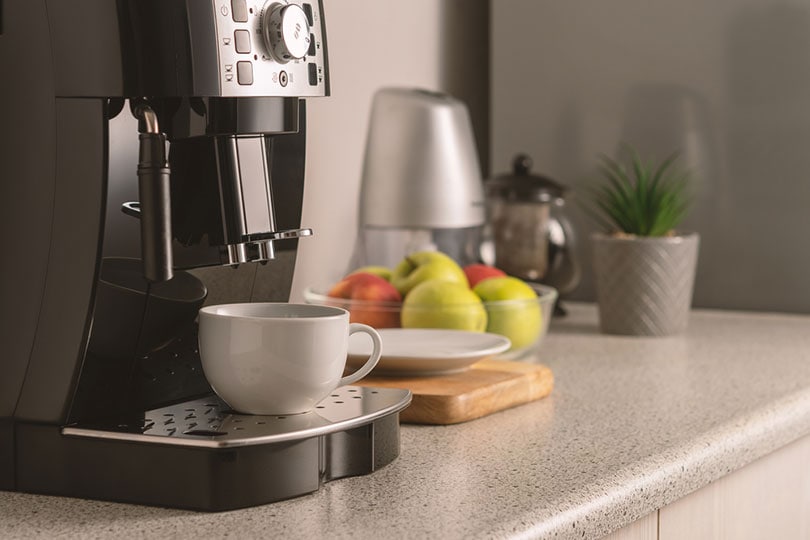 modern espresso coffee machine with a cup in the kitchen