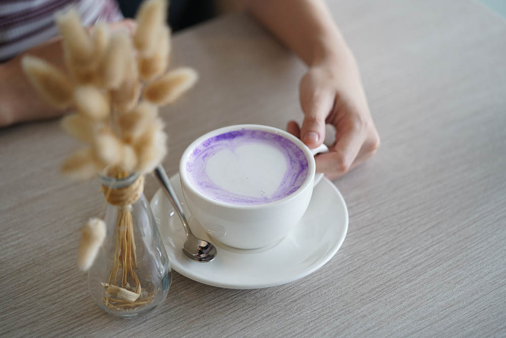 a cup of hot ube latte