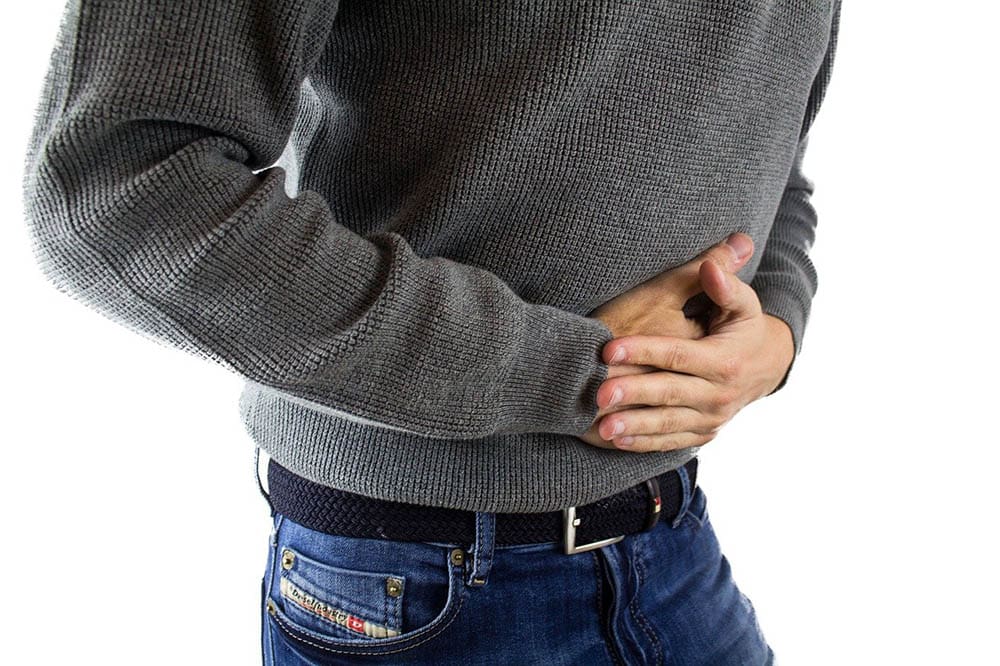 man having stomach pain