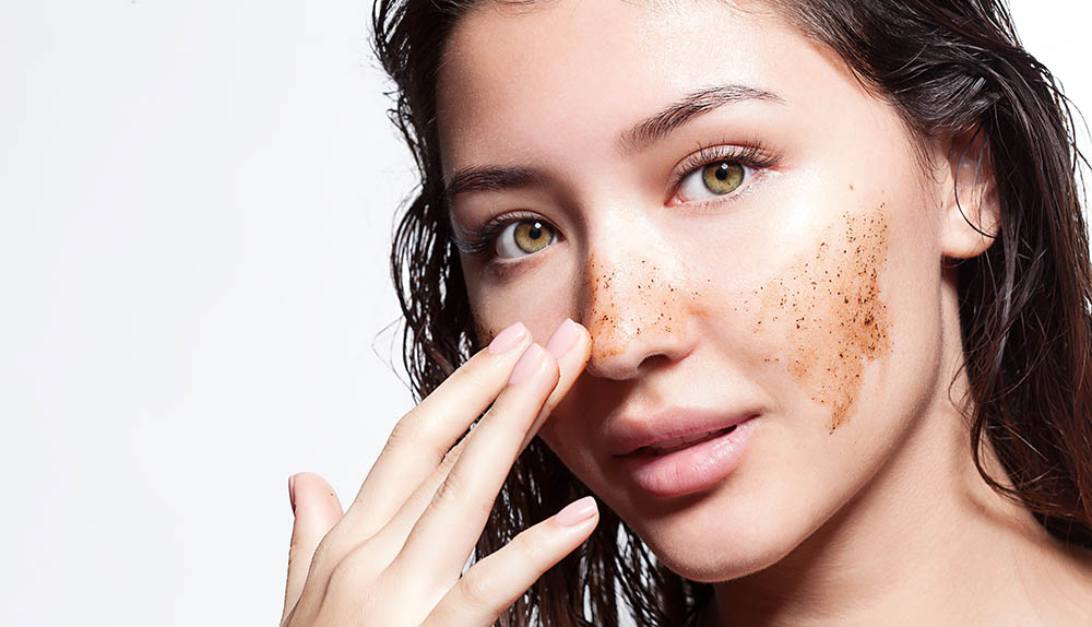 woman making fake freckles using coffee