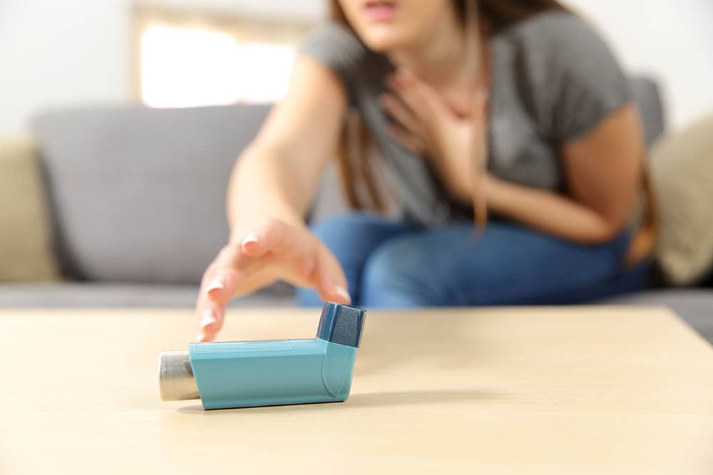 woman suffering from asthma attack