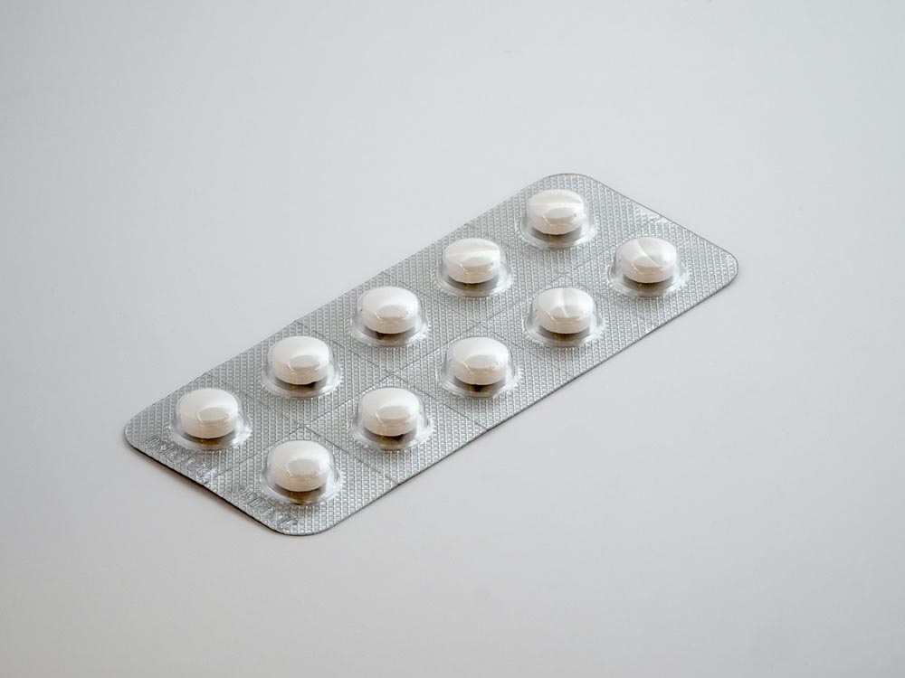 a pack of white tablets