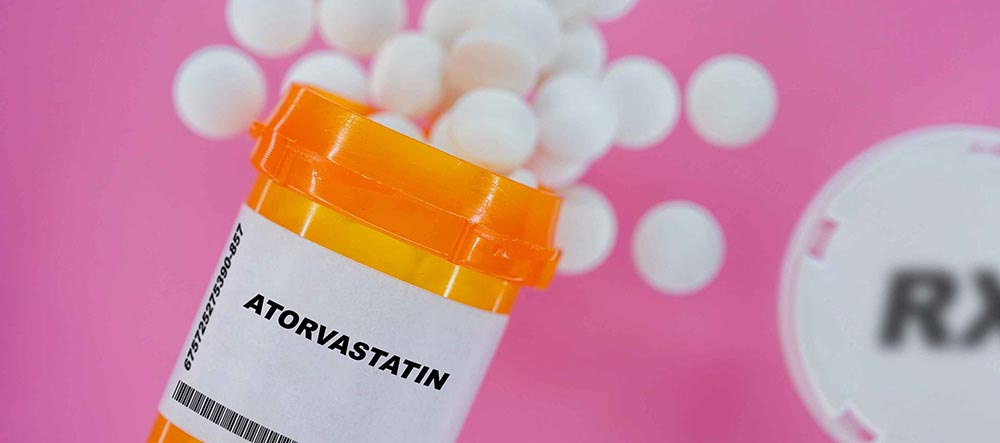Atorvastatin pills in plastic vial tablets