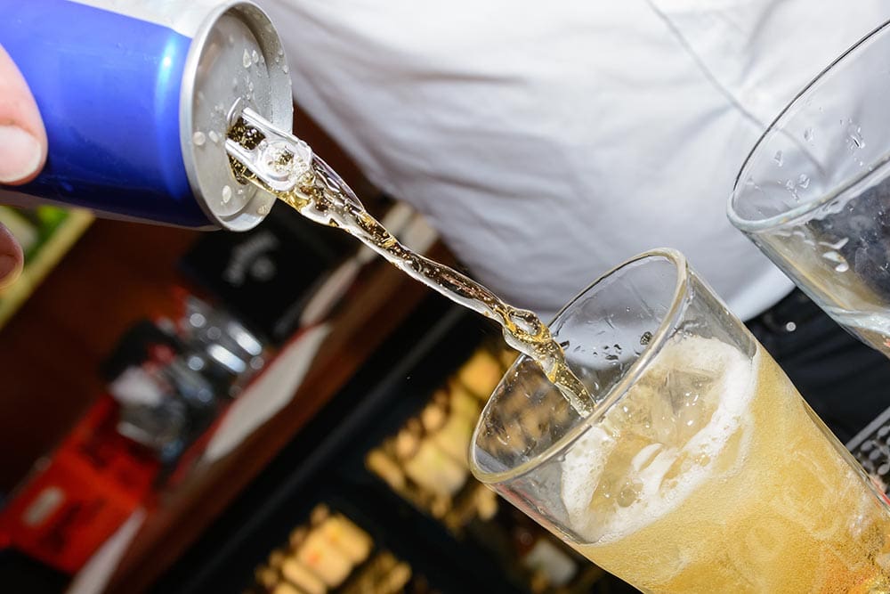 energy drink being poured into glass