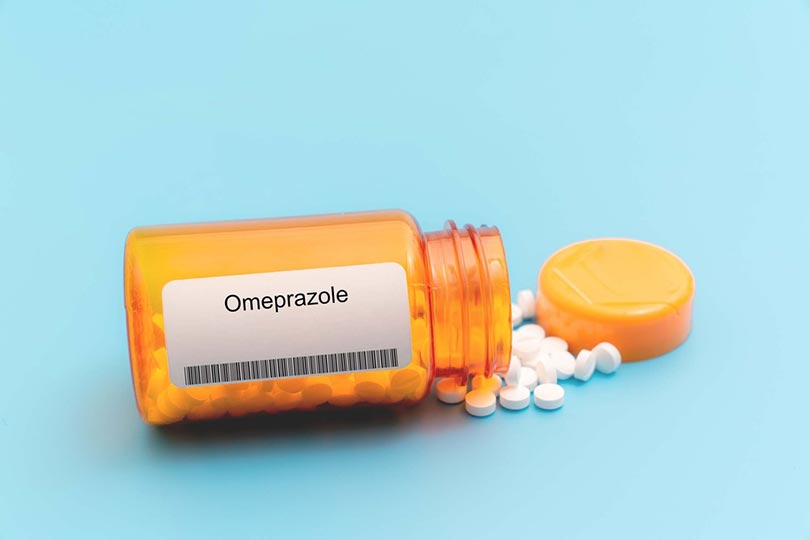 omeprazole medical pills in RX prescription drug bottle
