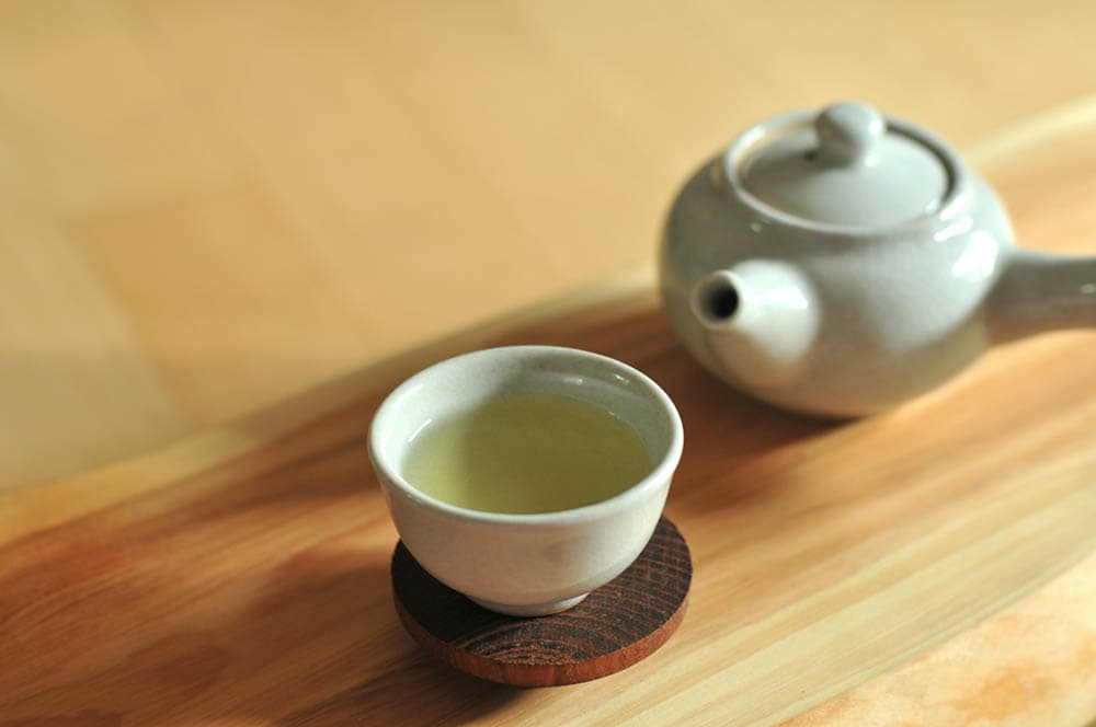 tea pot and a cup of green tea