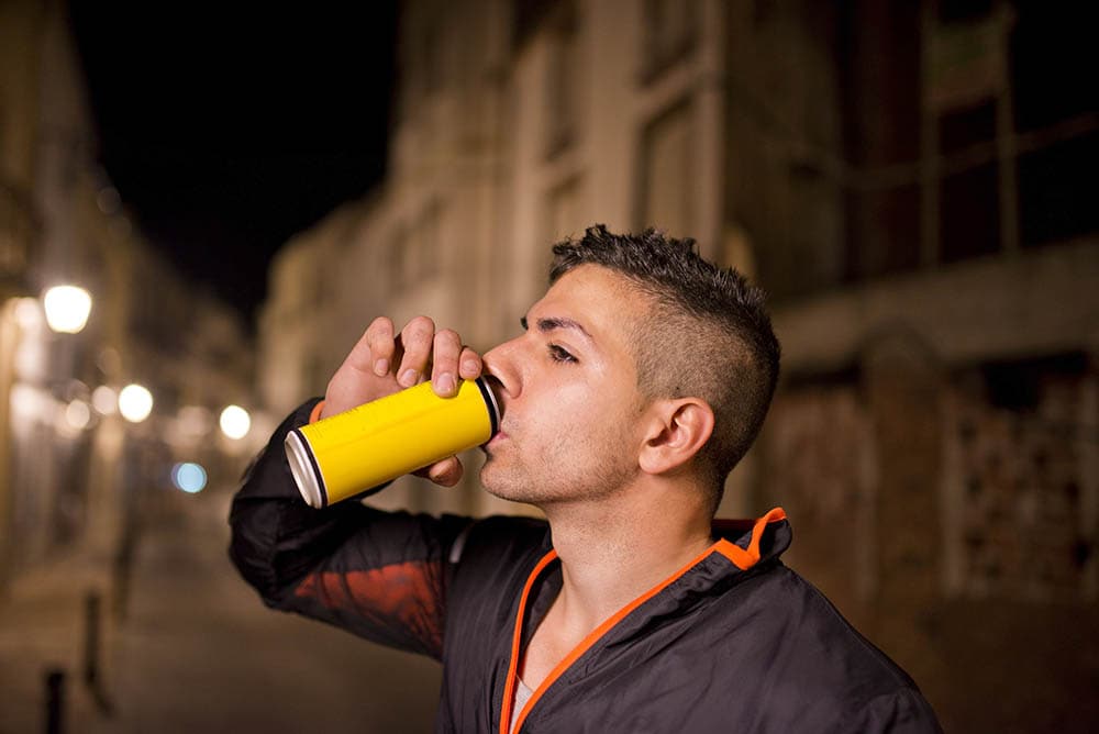 Young man drinking energy drink