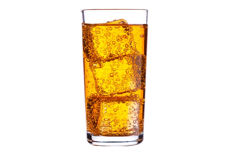 a glass of energy drink with ice