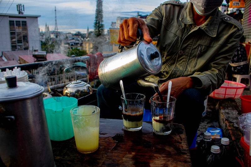 man making vietnamese coffee in vietnam