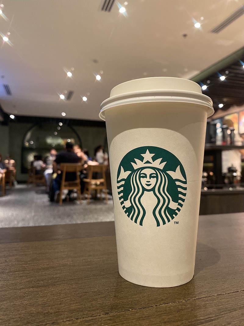 a cup of Starbucks hot drink in grande size