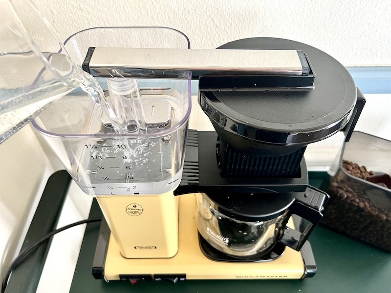 adding water to the Moccamaster coffee machine
