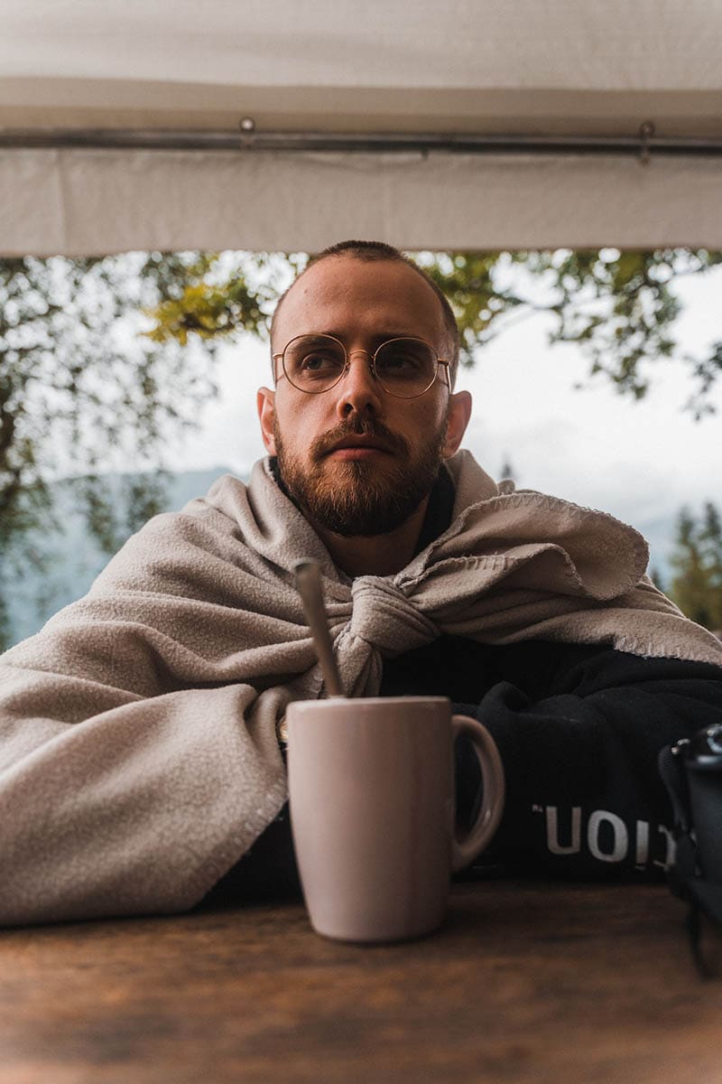 bald man drinking coffee