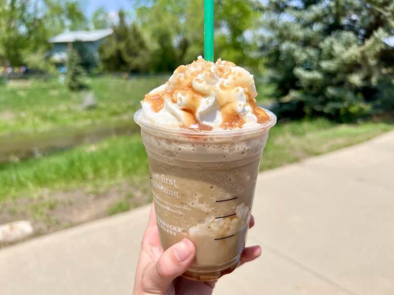 starbucks caramel ribbon frappuccino in summer outside