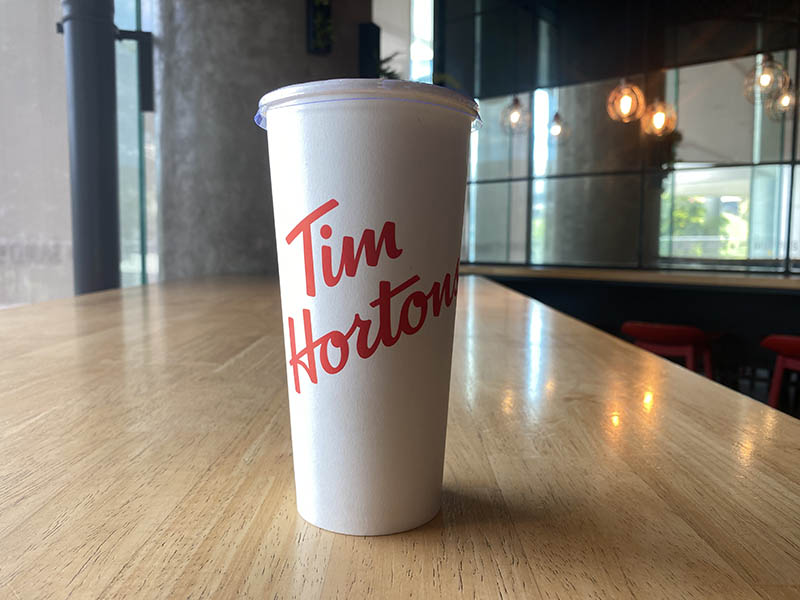 a cup of Tim Hortons drink on the table