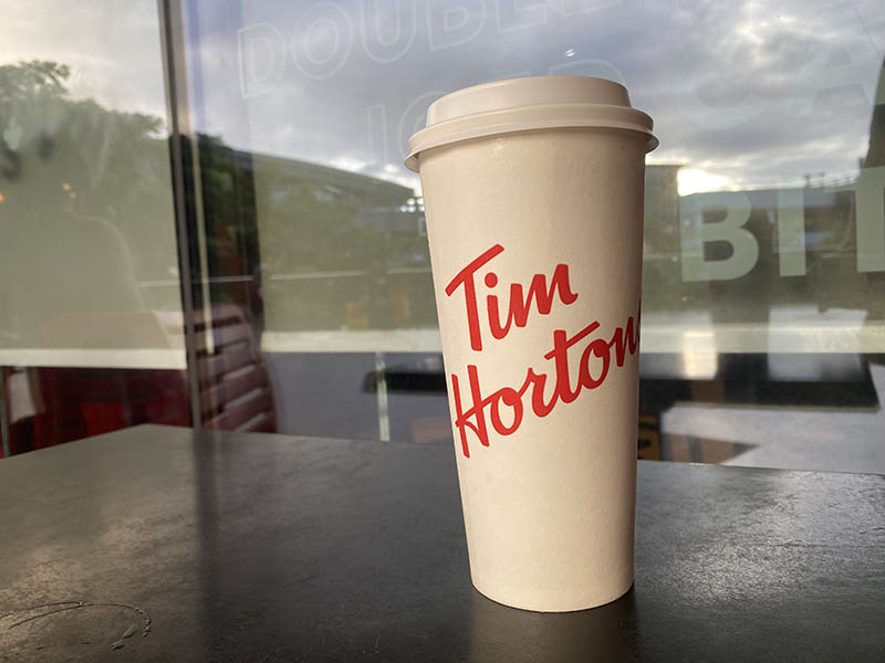 a cup of Tim Hortons hot drink on the table